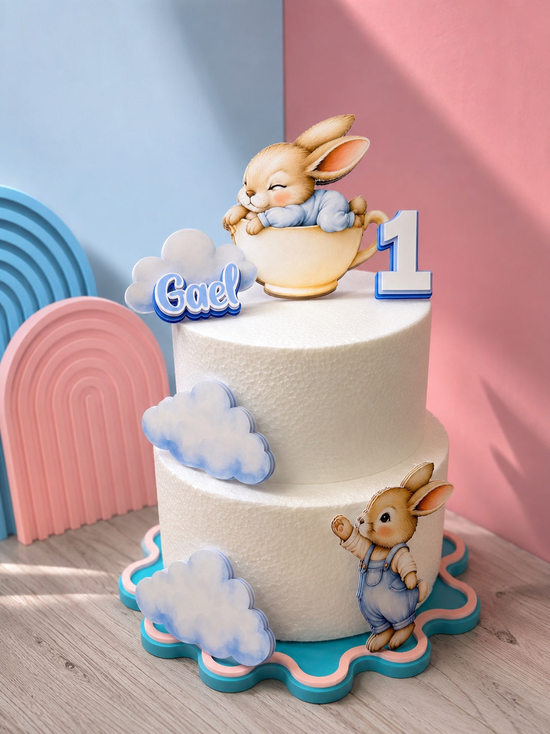 Personalized bunny themed first birthday cake decorations in blue and blush with clouds