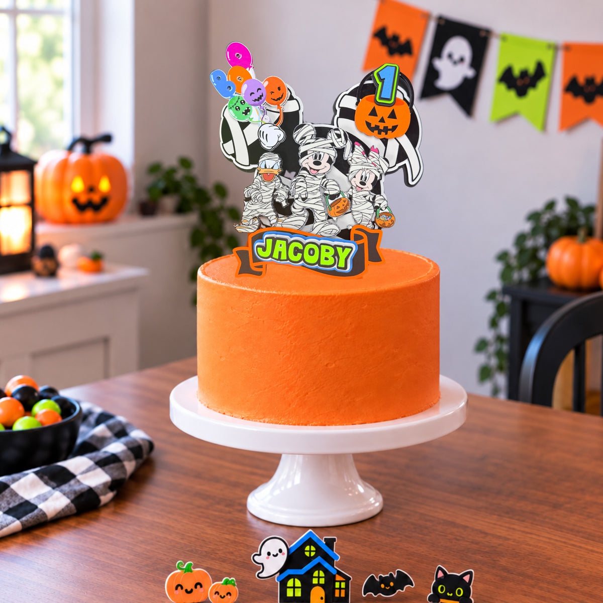 Personalized Halloween cake topper on orange cake