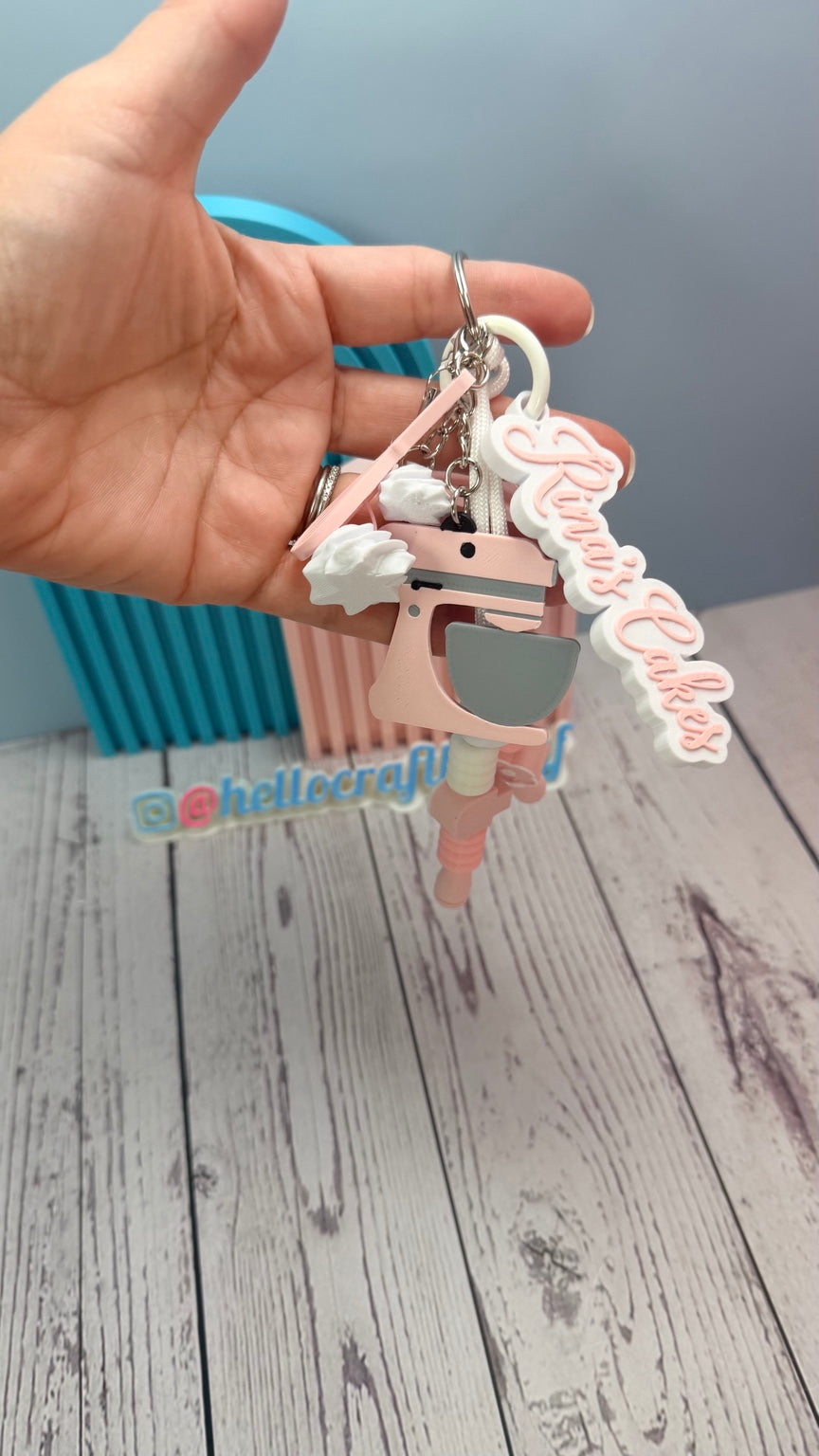 Personalized Sweet Baker keychain held in hand with pink mixer charm